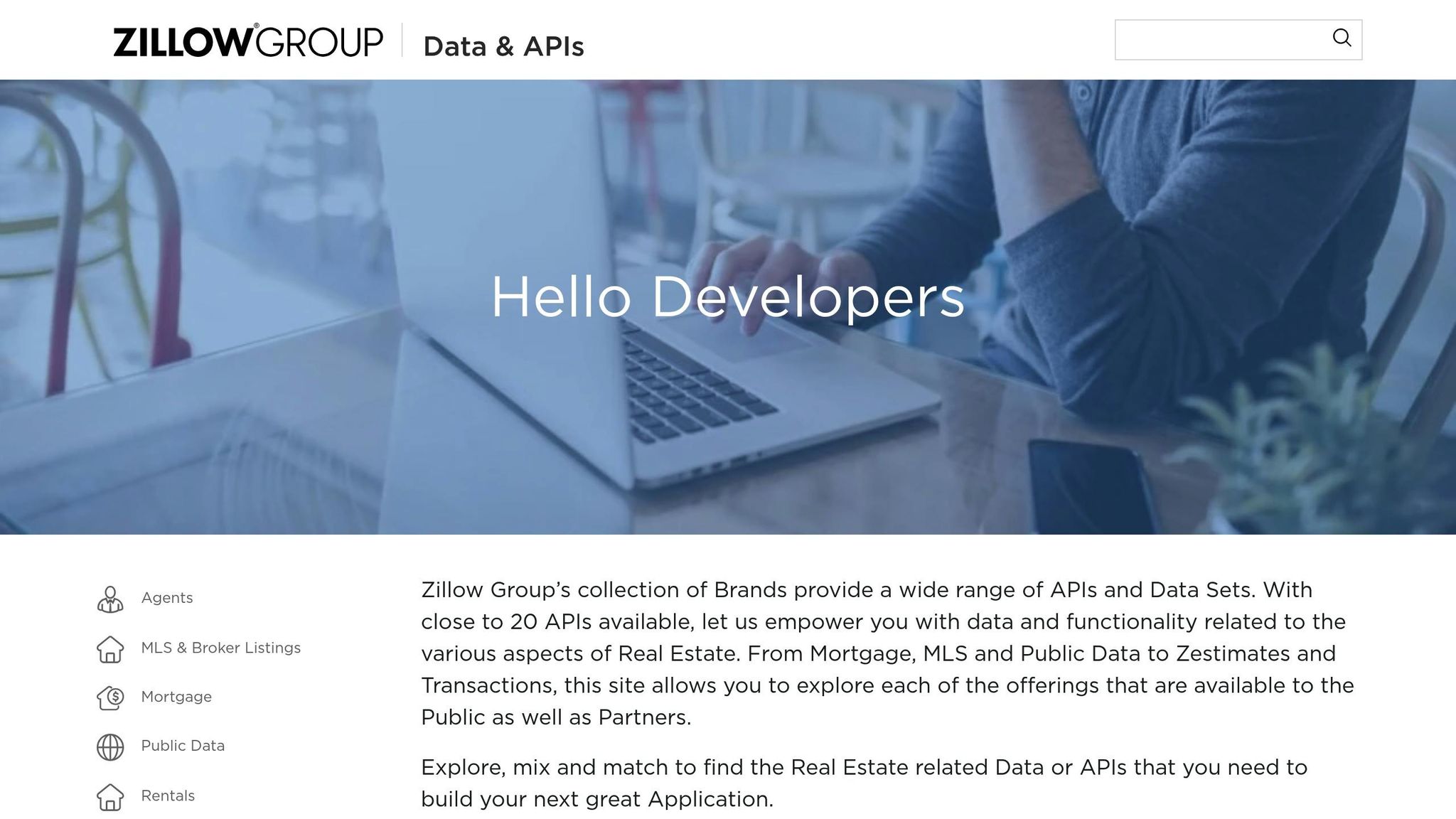 Person typing on a laptop with a focus on real estate APIs, illustrating BatchData's offerings for property data and API integration.