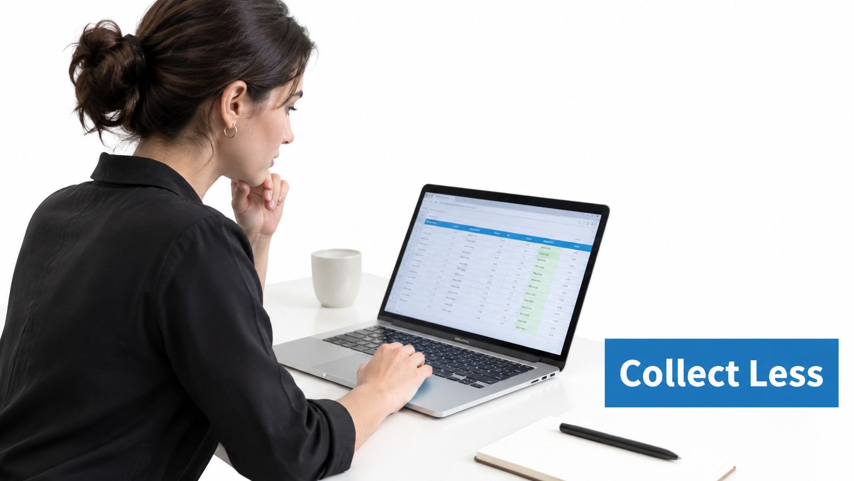 A businesswoman focused on data privacy best practices while working on her laptop in a bright office.